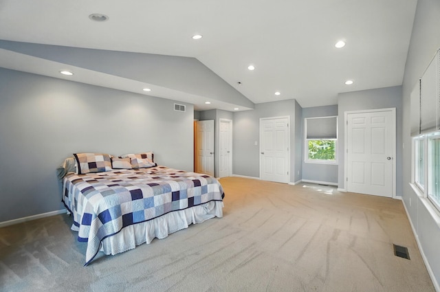 9113 Lake Ave, Huntsville, OH 43324 - bedroom with light colored carpet, vaulted ceiling, and recessed lighting