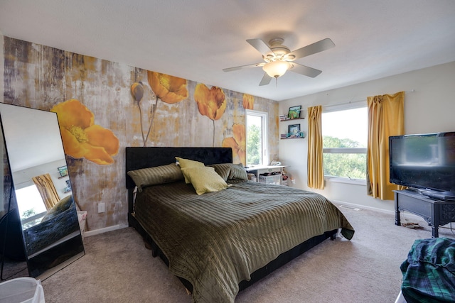 bedroom featuring light carpet and ceiling fan