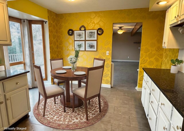 dining area featuring light tile patterned flooring