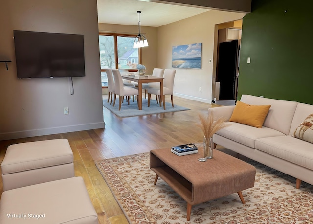 living room with light hardwood / wood-style flooring