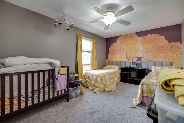 bedroom with ceiling fan and carpet flooring