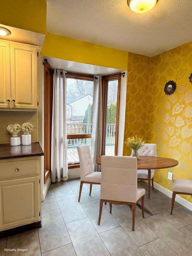 dining area with a textured ceiling