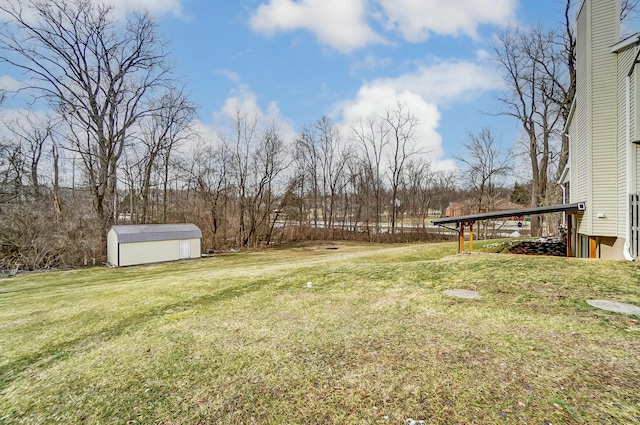 view of yard with an outdoor structure and a shed