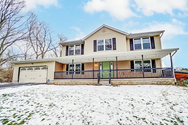 view of front of property featuring a garage and a porch