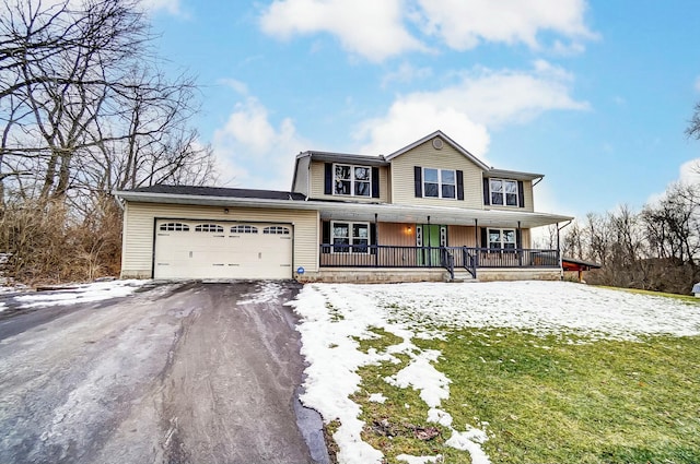 view of front of home with a garage, aphalt driveway, a porch, and a lawn