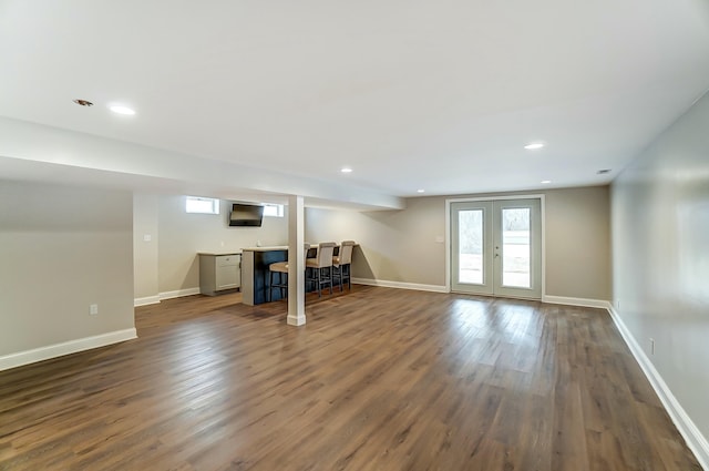 interior space with recessed lighting, french doors, dark wood finished floors, and baseboards