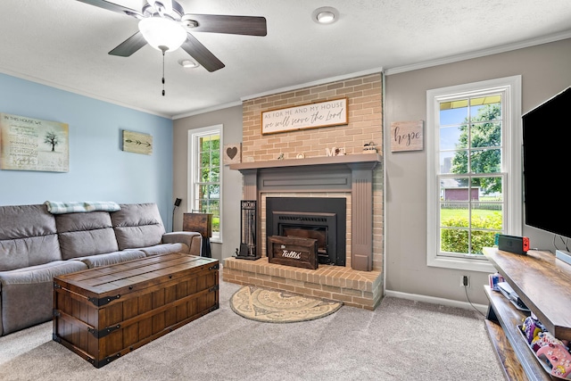 1686 Laurel Creek Dr, Troy, OH 45373 - carpeted living room featuring ornamental molding, healthy amount of natural light, a brick fireplace, and ceiling fan