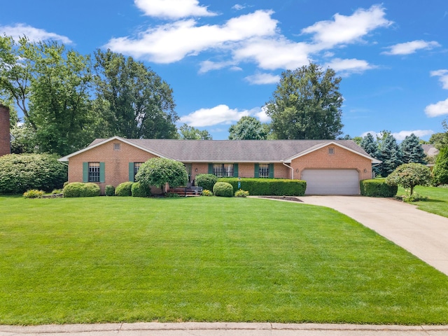 1686 Laurel Creek Dr, Troy, OH 45373 - ranch-style home featuring a garage, brick siding, concrete driveway, and a front yard