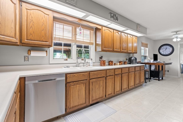 1686 Laurel Creek Dr, Troy, OH 45373 - kitchen featuring stainless steel dishwasher, brown cabinetry, light countertops, and an office area