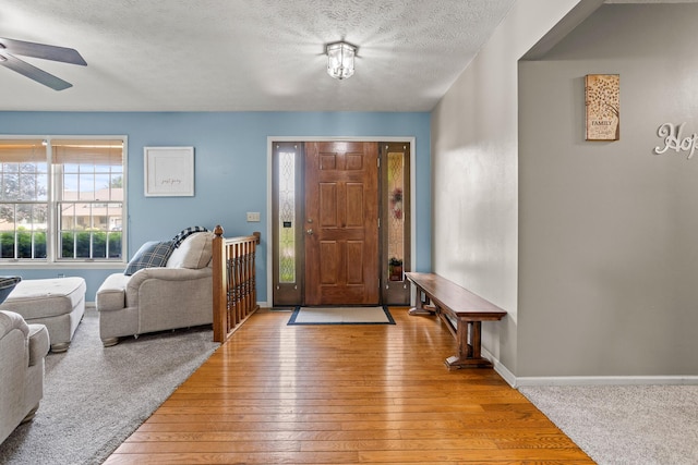 1686 Laurel Creek Dr, Troy, OH 45373 - foyer featuring ceiling fan, a textured ceiling, and light wood-style floors