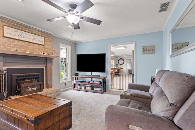 1686 Laurel Creek Dr, Troy, OH 45373 - living area featuring carpet, a ceiling fan, a fireplace, crown molding, and a textured ceiling
