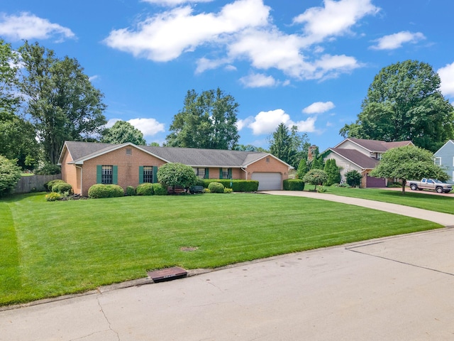 1686 Laurel Creek Dr, Troy, OH 45373 - view of front of home featuring concrete driveway, brick siding, and a garage
