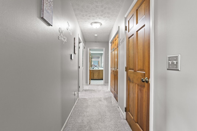 1686 Laurel Creek Dr, Troy, OH 45373 - corridor with a textured ceiling and light carpet