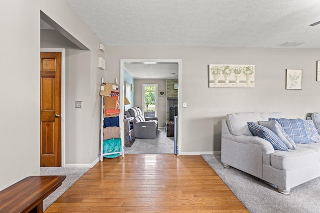 1686 Laurel Creek Dr, Troy, OH 45373 - living area with a textured ceiling and wood-type flooring