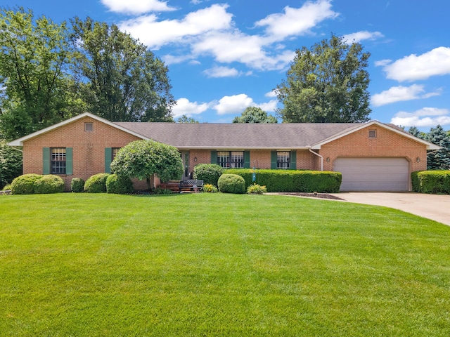 1686 Laurel Creek Dr, Troy, OH 45373 - ranch-style house featuring brick siding, a garage, and a front lawn