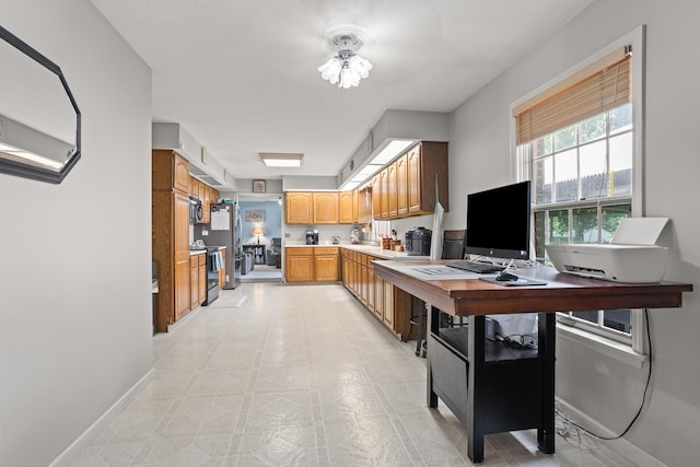 1686 Laurel Creek Dr, Troy, OH 45373 - kitchen featuring stainless steel appliances, light countertops, and brown cabinets