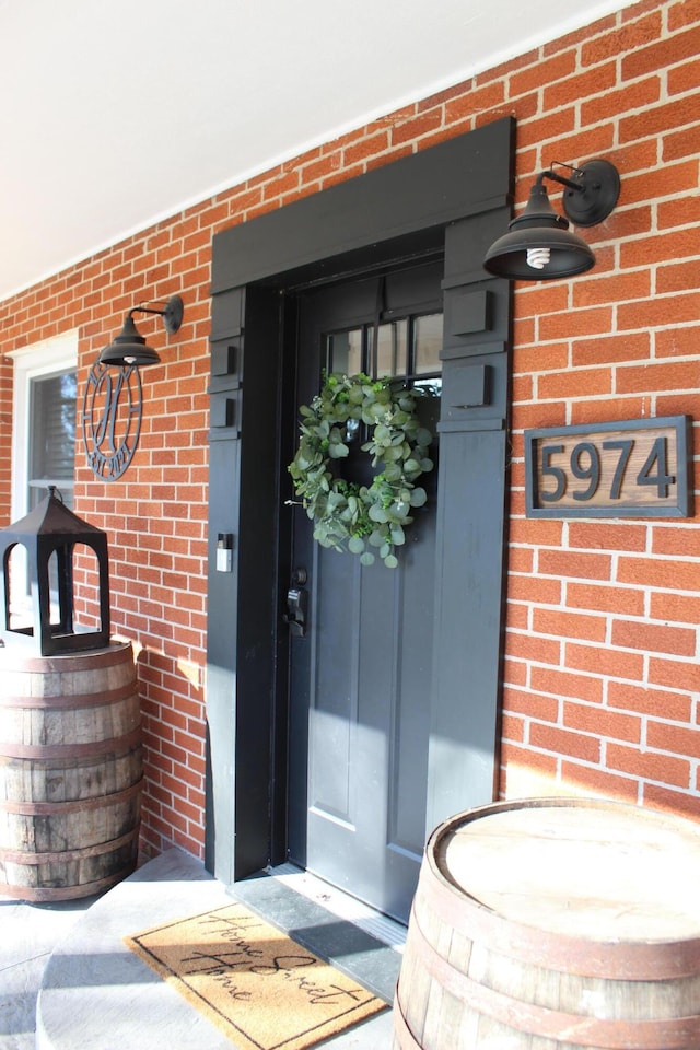 entrance to property with brick siding