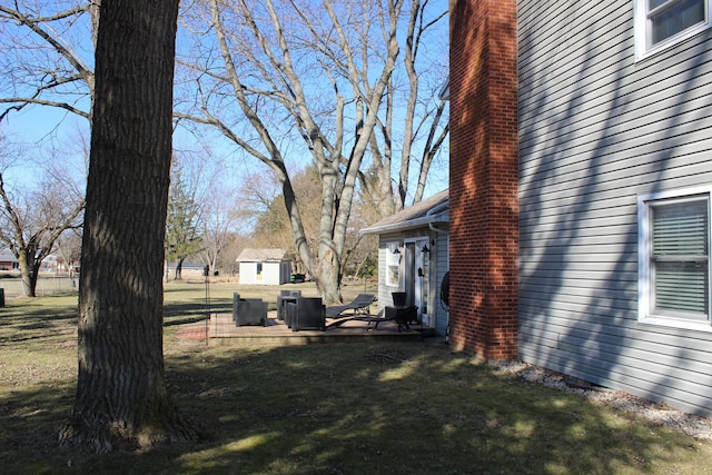 view of yard featuring an outdoor structure and a shed
