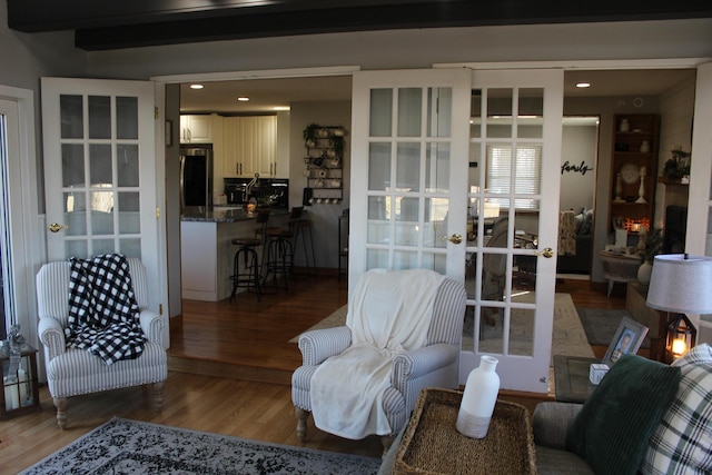 living room with french doors and wood finished floors
