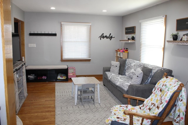 living room featuring recessed lighting and wood finished floors