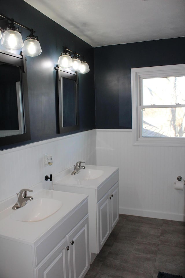 bathroom with wainscoting and vanity