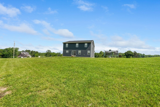 5266 State Route 540, Bellefontaine, OH 43311 - back of property featuring a trampoline and a lawn