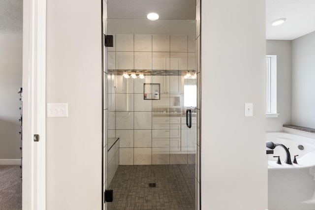 5266 State Route 540, Bellefontaine, OH 43311 - bathroom with a shower stall, a garden tub, and recessed lighting