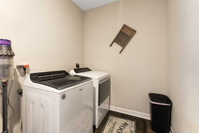 5266 State Route 540, Bellefontaine, OH 43311 - washroom featuring washer and clothes dryer and dark wood-style flooring