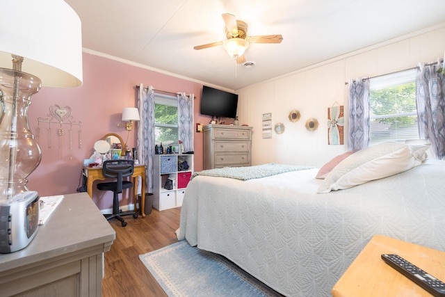 844 Reservoir Rd, Bellefontaine, OH 43311 - bedroom with ornamental molding, multiple windows, wood finished floors, and a ceiling fan