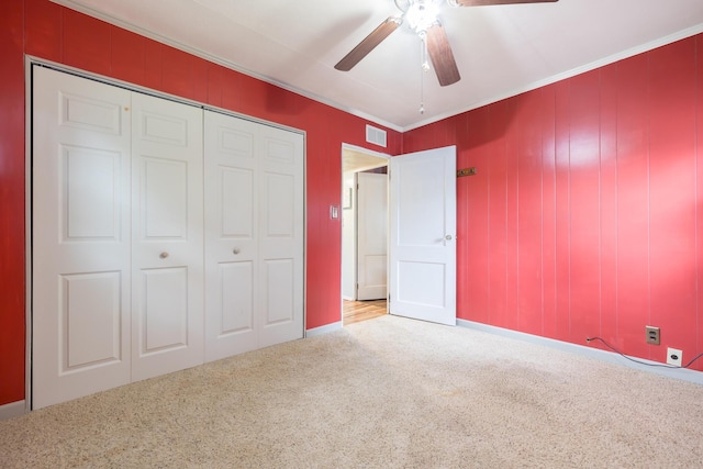 844 Reservoir Rd, Bellefontaine, OH 43311 - unfurnished bedroom featuring carpet, a closet, crown molding, and ceiling fan