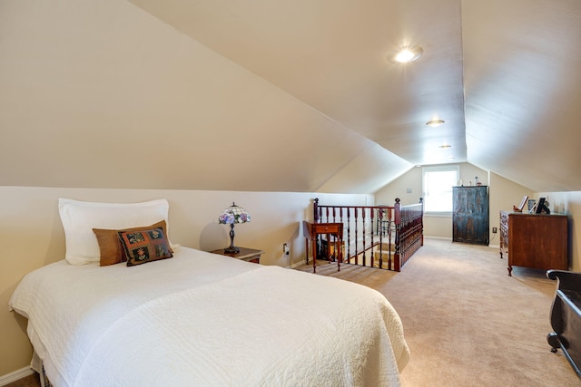 bedroom with carpet flooring and vaulted ceiling