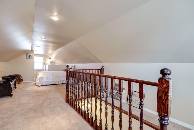 carpeted bedroom featuring lofted ceiling