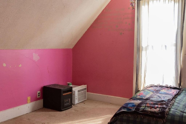 additional living space featuring carpet floors and vaulted ceiling