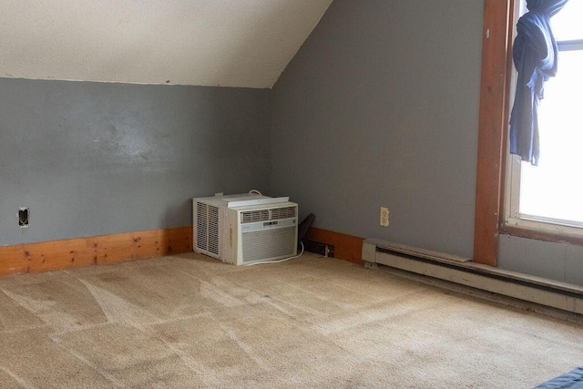 bonus room featuring lofted ceiling, carpet floors, and a baseboard radiator