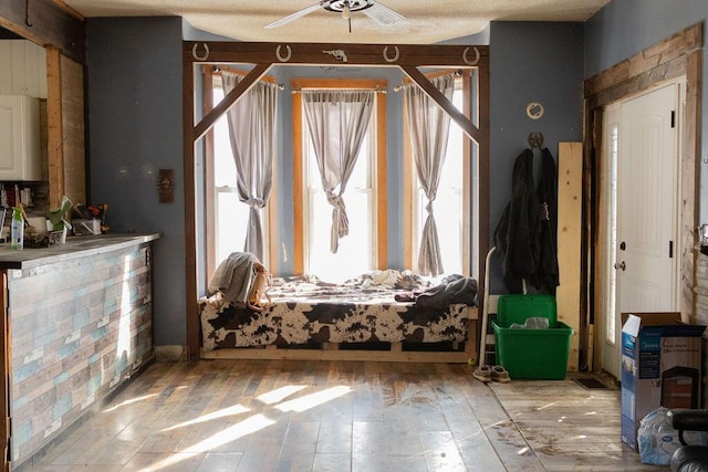 sitting room featuring ceiling fan