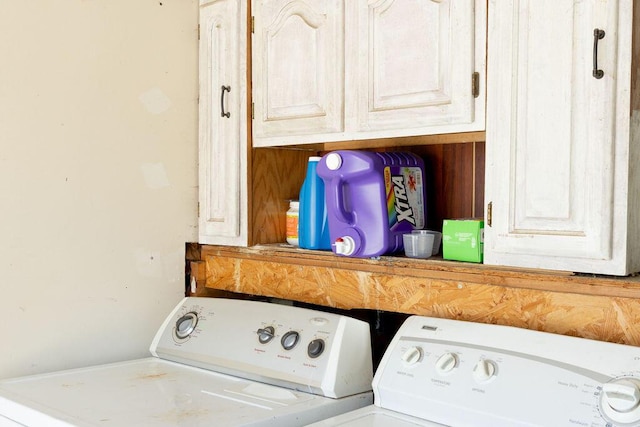 laundry area featuring cabinets and independent washer and dryer