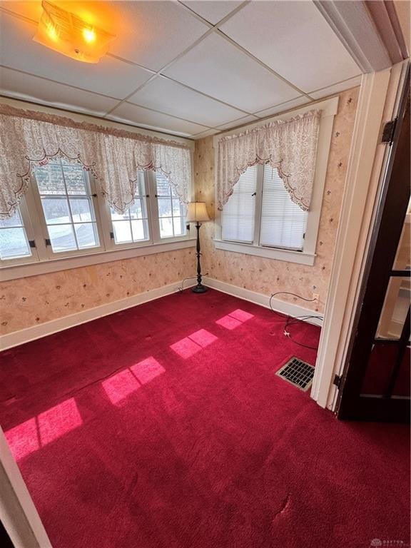 230 New Columbia Blvd, Sidney, OH 45365 - unfurnished room with baseboards, visible vents, wallpapered walls, and dark colored carpet