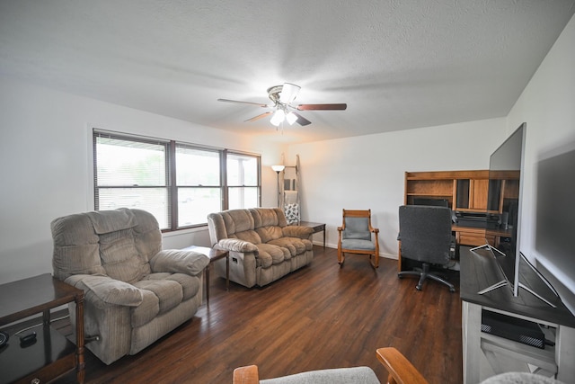 living room featuring ceiling fan and dark wood finished floors