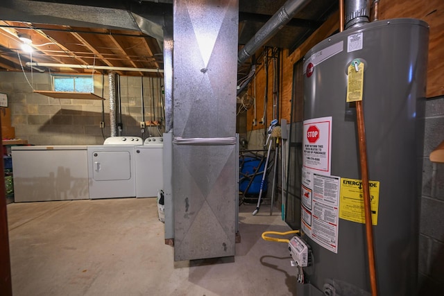 below grade area featuring heating unit, gas water heater, refrigerator, and washing machine and dryer