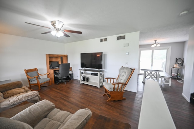 living room featuring visible vents, ceiling fan, and wood finished floors
