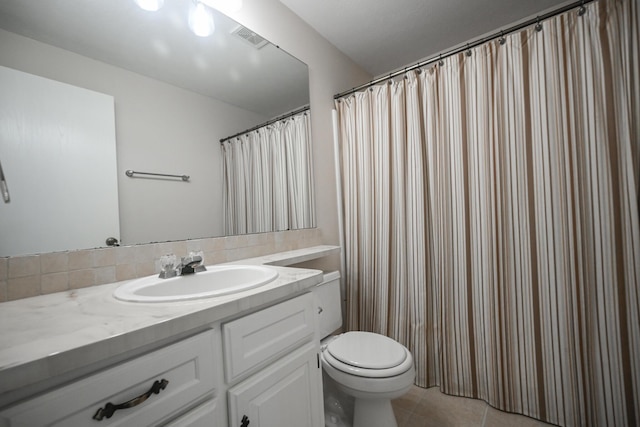 bathroom featuring tile patterned flooring, visible vents, toilet, and vanity