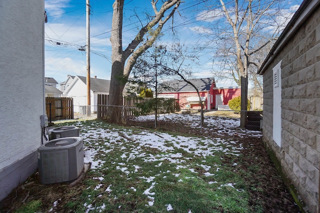 yard covered in snow with cooling unit