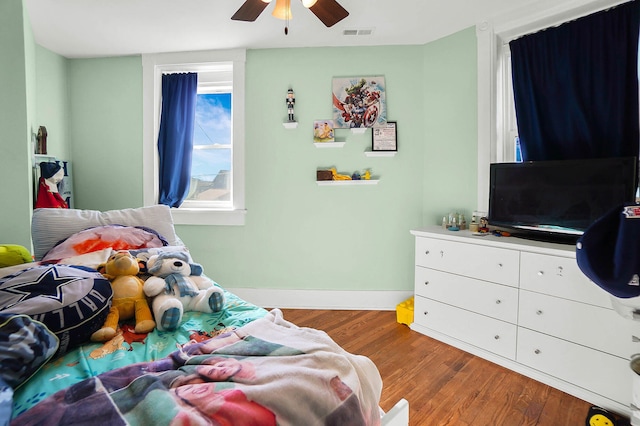 bedroom featuring wood-type flooring and ceiling fan