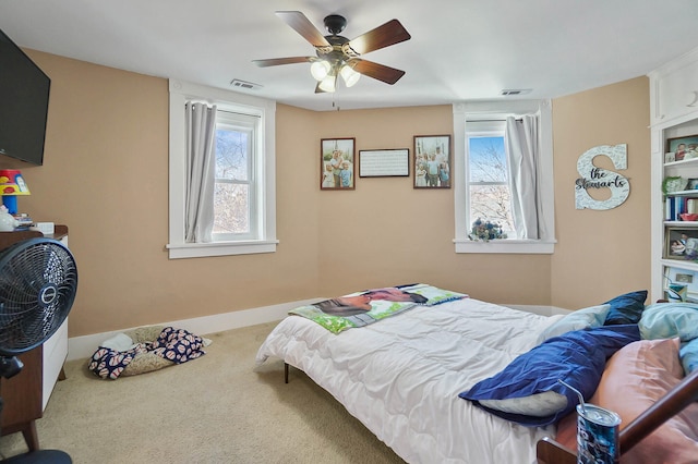 carpeted bedroom featuring ceiling fan