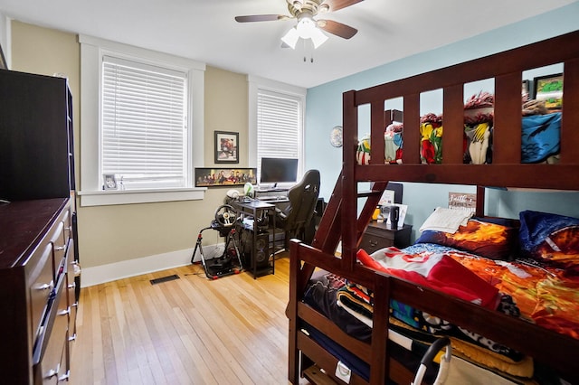 bedroom featuring ceiling fan and light hardwood / wood-style flooring