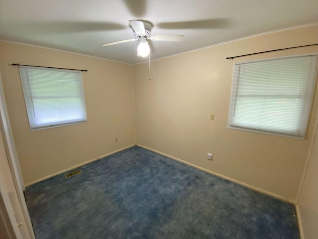 2647 Allen Dr, Springfield, OH 45505 - unfurnished room with dark colored carpet, a ceiling fan, and crown molding