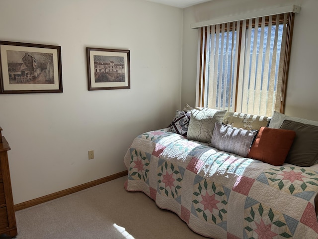 bedroom featuring baseboards and carpet floors
