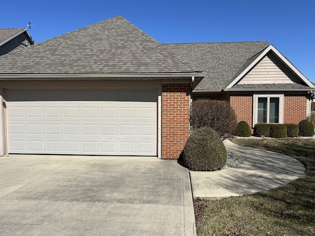 single story home featuring a garage, brick siding, driveway, and a shingled roof