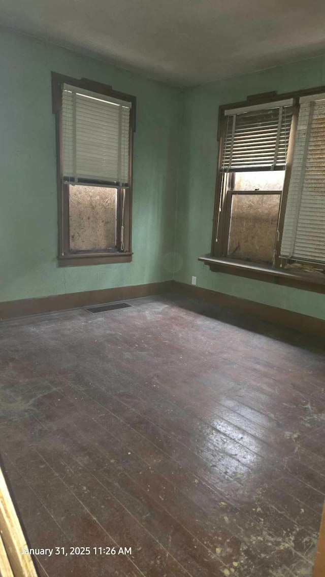 unfurnished room featuring dark hardwood / wood-style floors