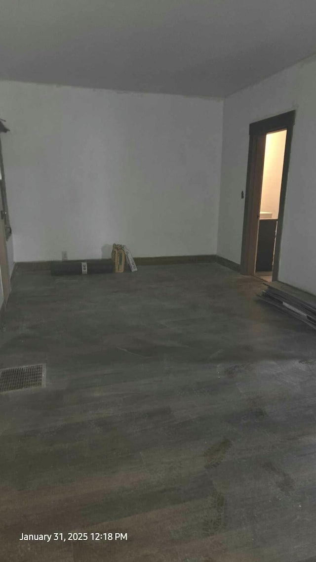 unfurnished room with dark hardwood / wood-style floors